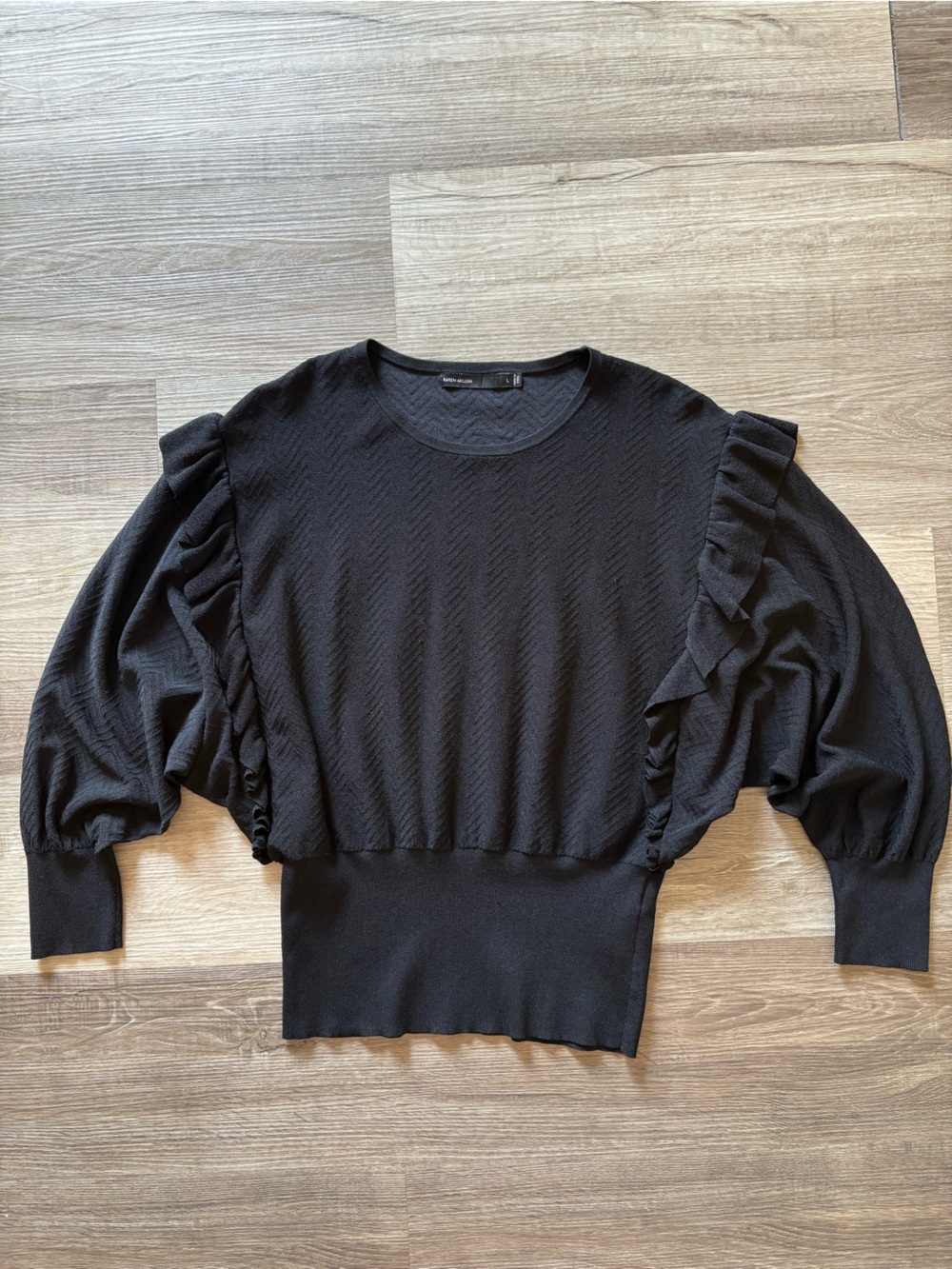 Women's black ruffle sweater
